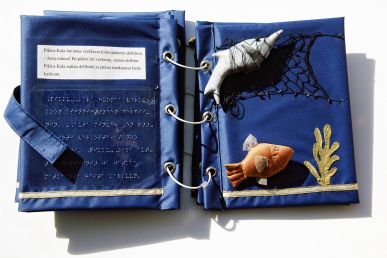 A picture of a tactile book with fish.