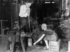 Black and white picture of two glassmakers.