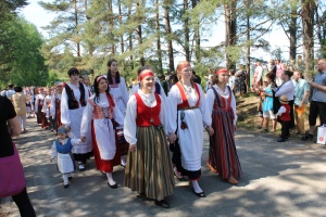 People wearing folk costumes.