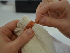 Closeup of a person embroidering.