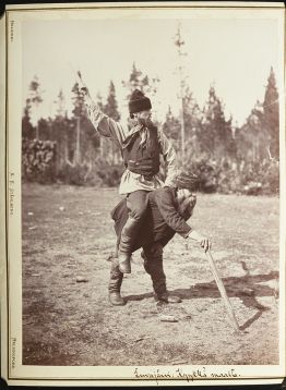 Black and white picture of a person piggybacking another person.
