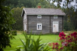A small gray cabin.