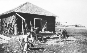 Black and white picture of making a clinker boat.