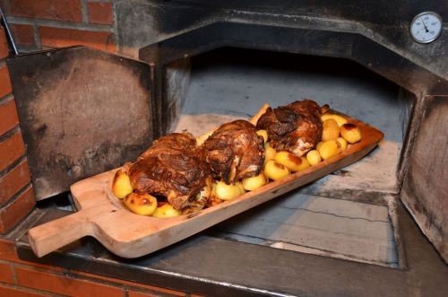 Potatoes and lamb meet on top of a serving plate.
