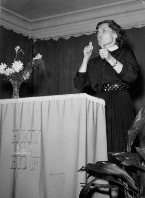 Black and white picture of a person giving a speech.