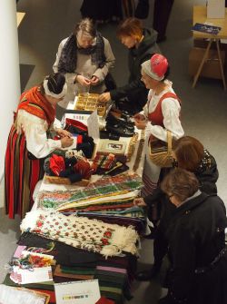 Salesperson presenting products to customers.